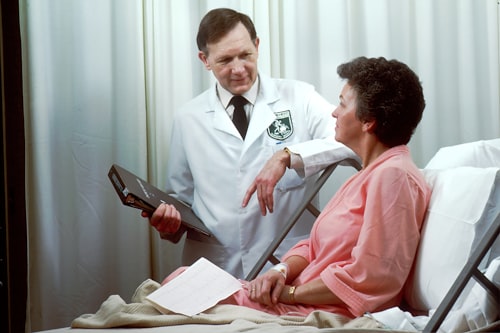 Medical specialist with patient